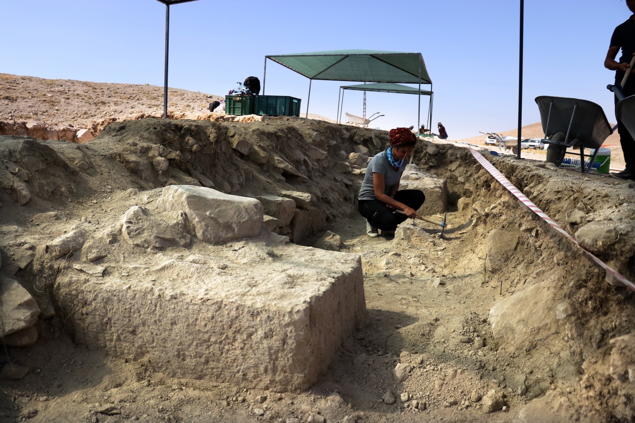 An archeological team works on excavating the theater complex of the ancient city of Savatra, in Konya, Turkey, Aug. 27, 2021. (AA Photo)